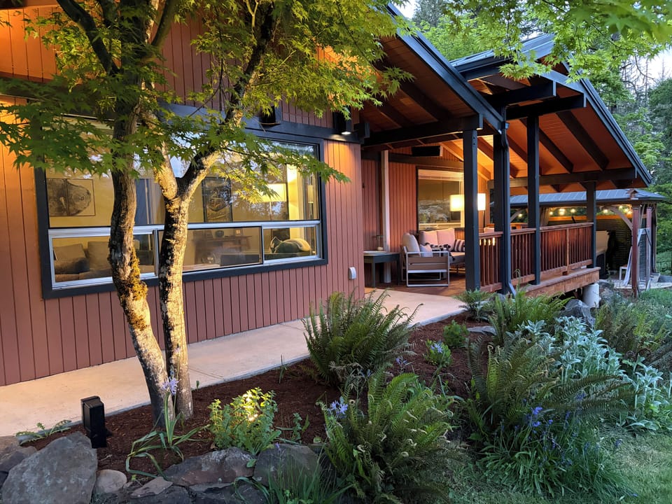 Covered front walkway to entry with covered front porch. 