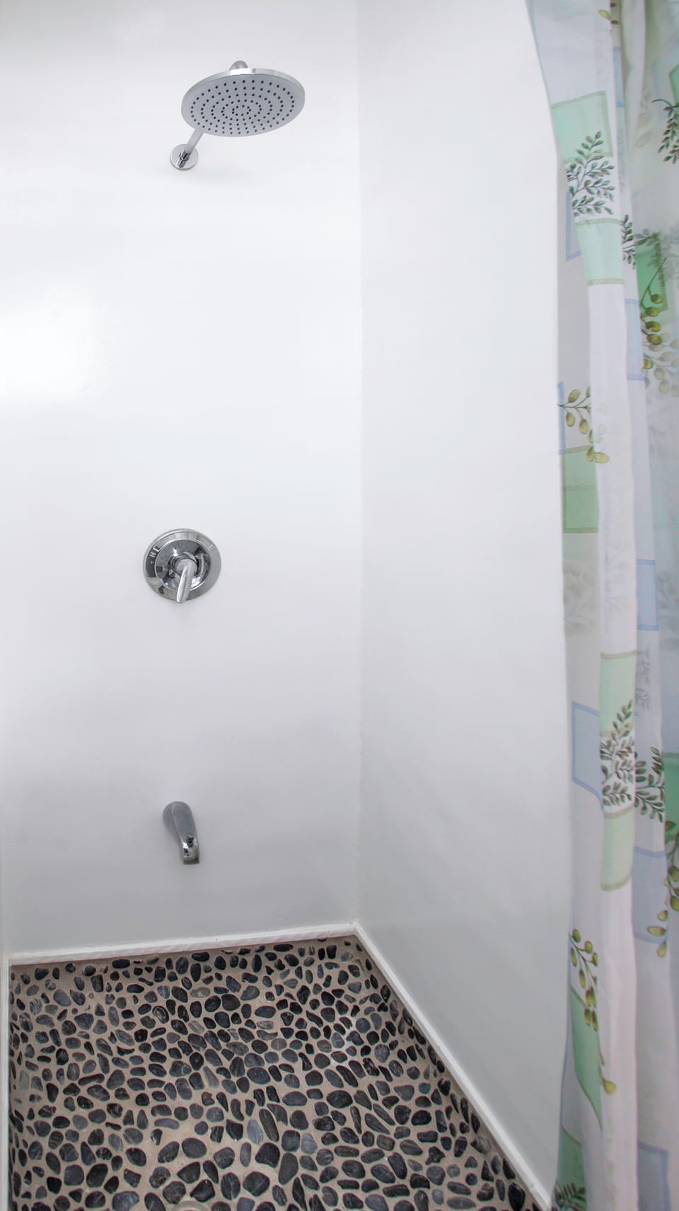 Bathroom #1 situated downstairs with toilet and shower.