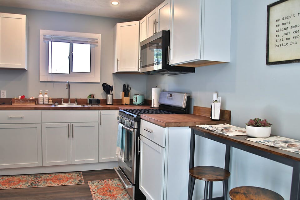 Full kitchen ideal for extended stay cook, dine, and feel right at home.