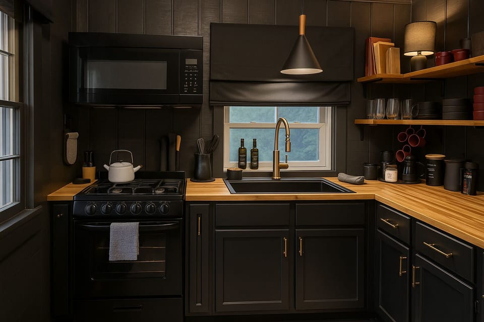Stylish black kitchen with Nespresso, Keurig, and everything you need to cook at home.