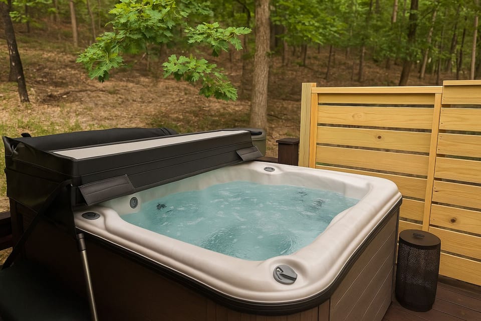 Enjoy the peace of nature from your own bubbling hot tub — a must-have cabin luxury.