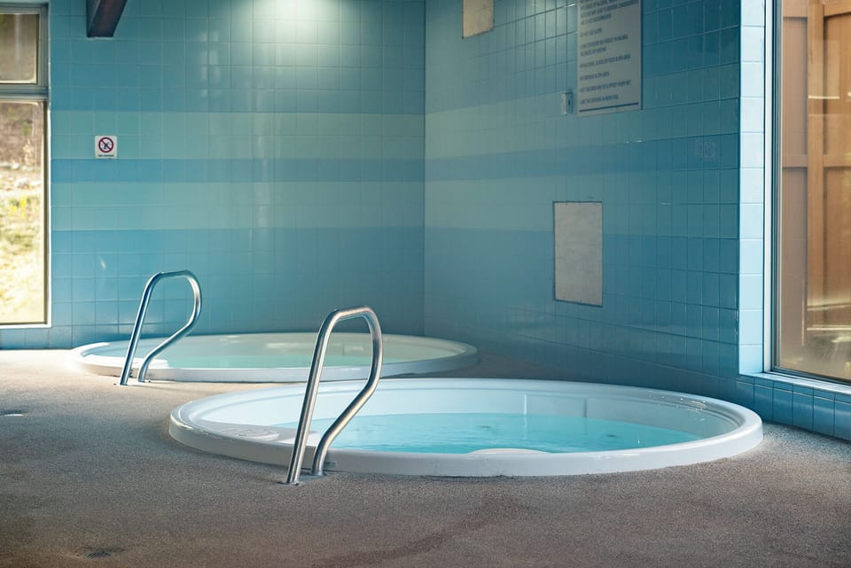 Soak your worries away in these soothing hot tubs, where warm waters and tranquil blue tiles create your perfect relaxation retreat.