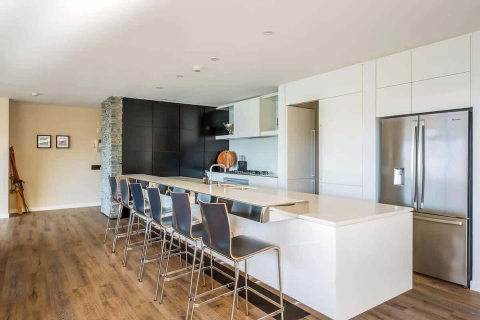 The modern kitchen features top-of-the-line appliances and ample counter space for all your cooking needs. Whether preparing a quick breakfast or a gourmet dinner, you’ll find everything at your fingertips.