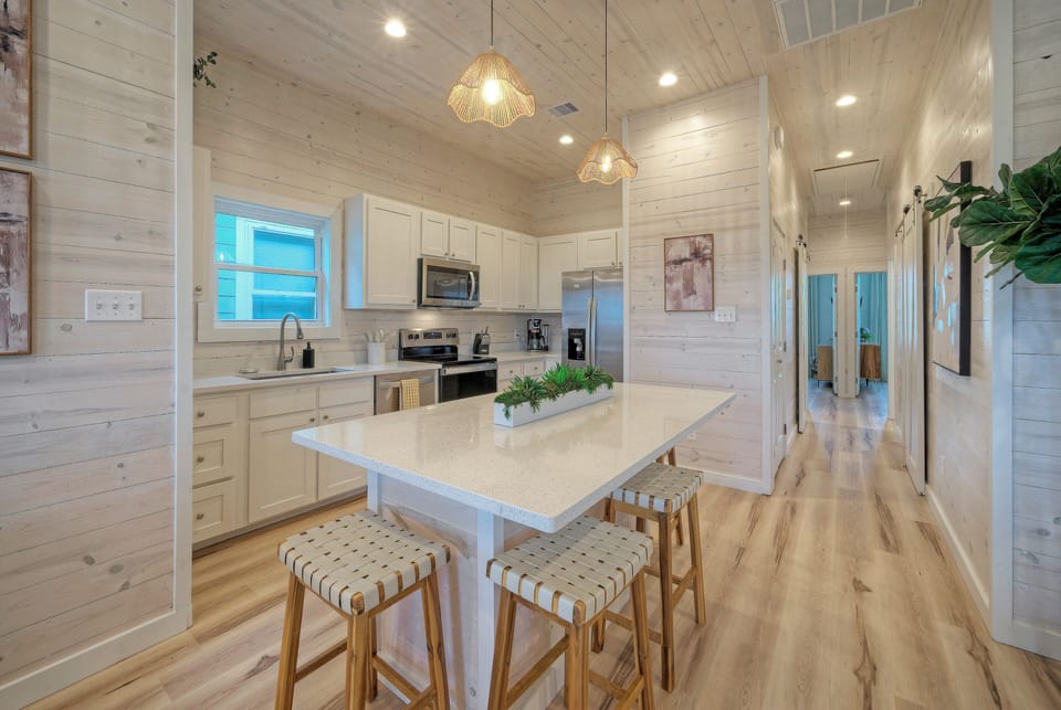 Bright kitchen area featuring a spacious island.