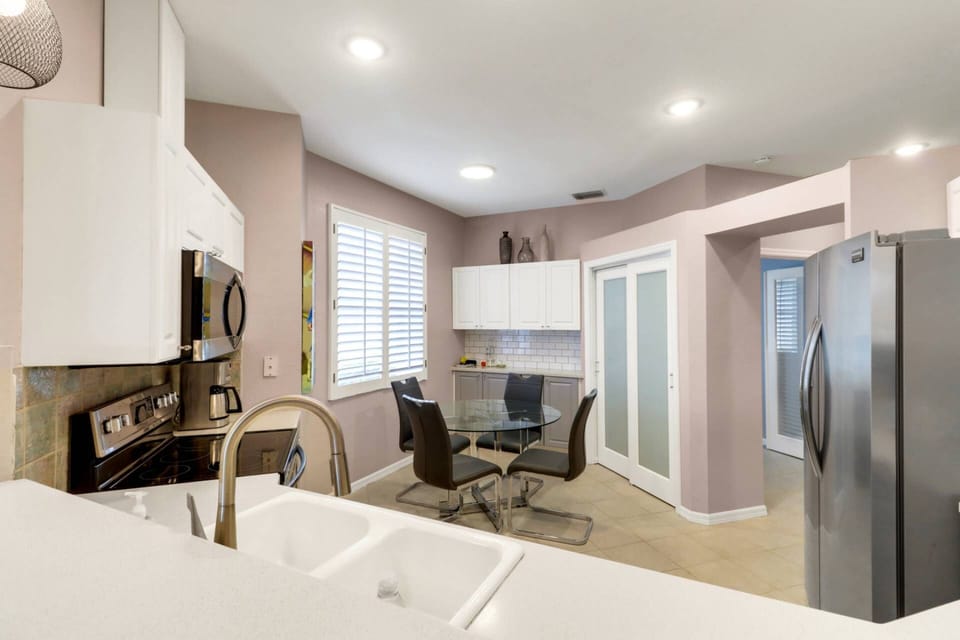 Cookware, dinnerware, many kitchen tools and small appliances are provided for your use; a spacious pantry finishes the space.
