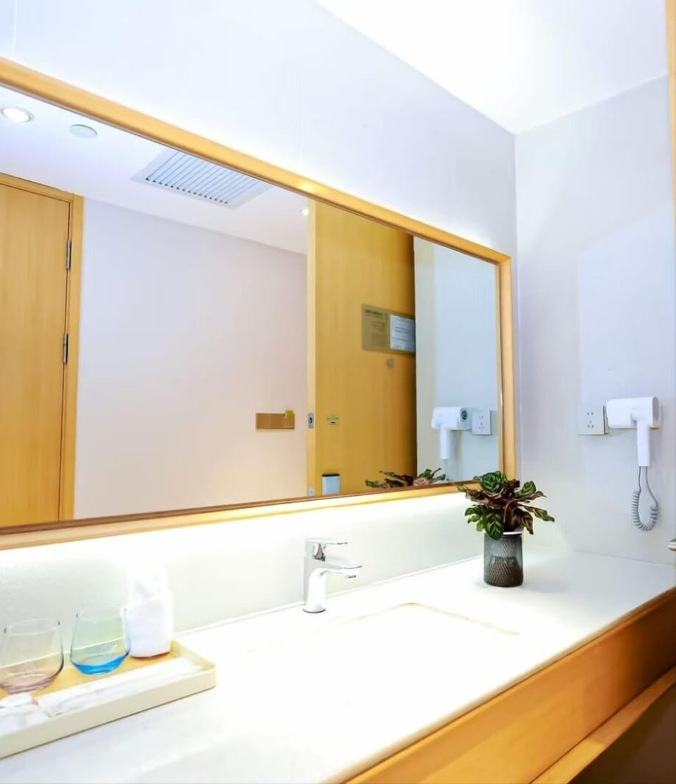 Basic Twin Room | Bathroom | Shower, hair dryer, slippers, towels