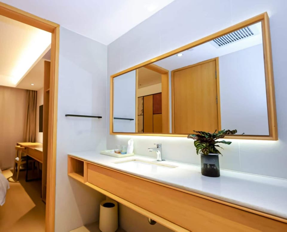 Basic Twin Room | Bathroom | Shower, hair dryer, slippers, towels