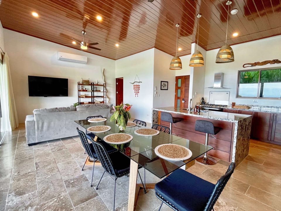 Open floor plan with well equipped kitchen and comfortable living room. 