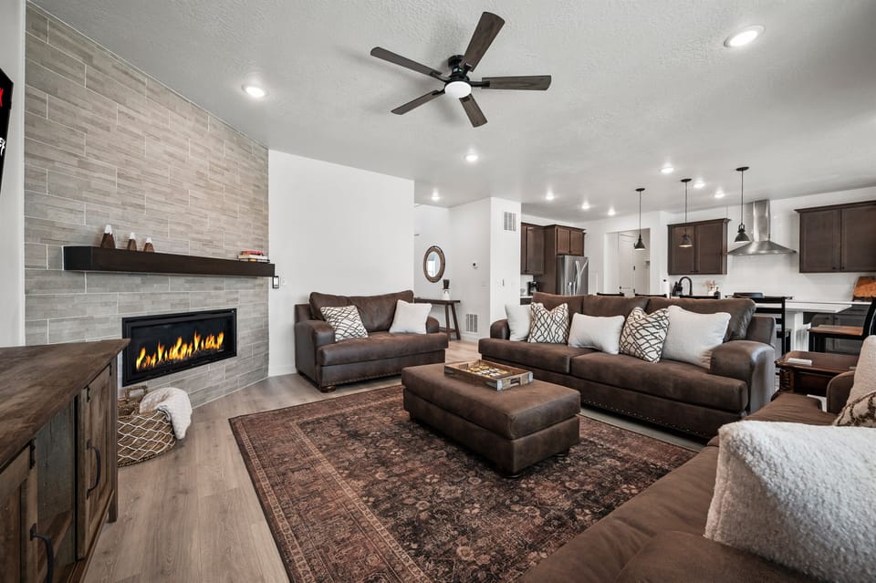 Curl up with a good book by the electric fireplace or stream your favorite show on the large Smart TV—this cozy living room was made for unwinding.