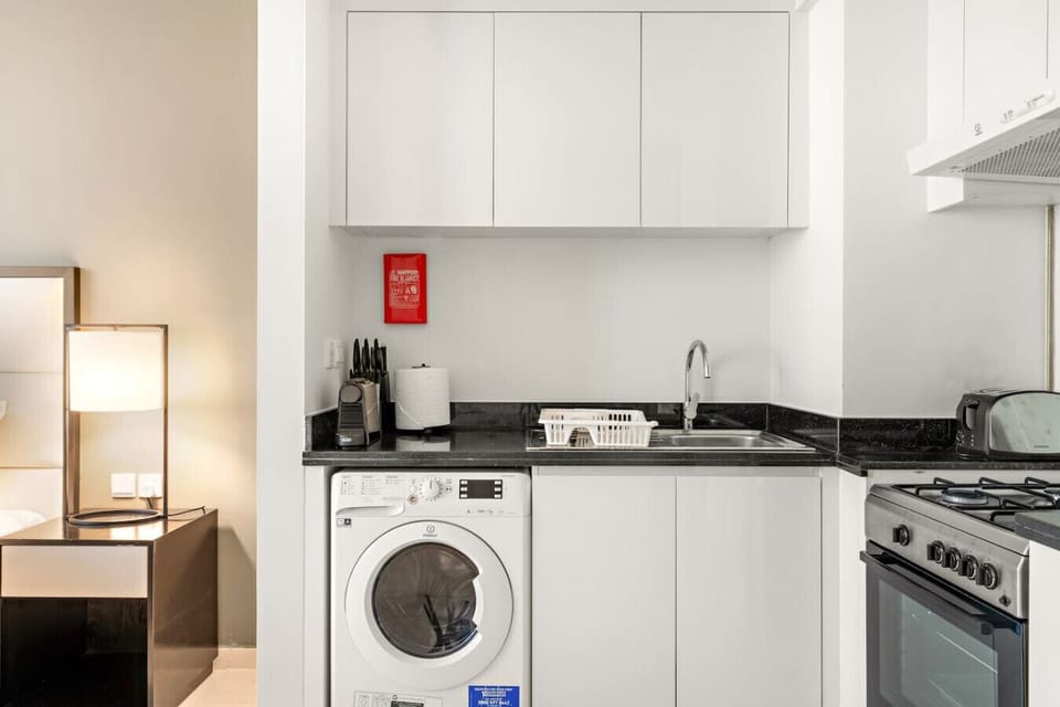 Modern Kitchenette: Enjoy style and convenience with essential appliances and sleek finishes!