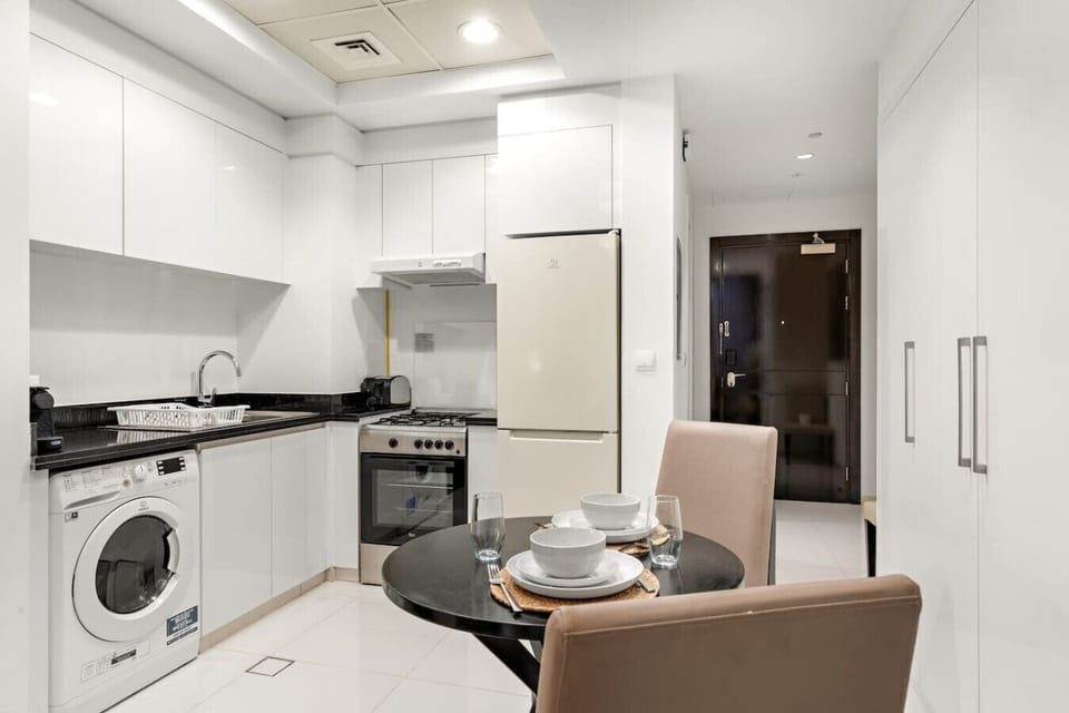 Modern Kitchen: Enjoy culinary adventures in this sleek, fully-equipped kitchen with stylish finishes!