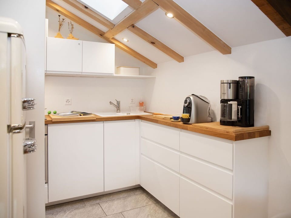 Countertop, Kitchen, Interior Design, Flooring, Wood, Furniture, Cabinetry, Kitchen Appliance, Ceiling, Floor