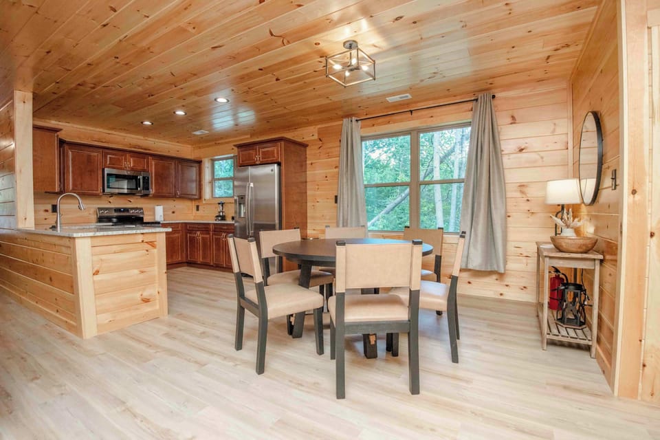 Gather around for meals with a view in this stylish, wood-paneled space!
