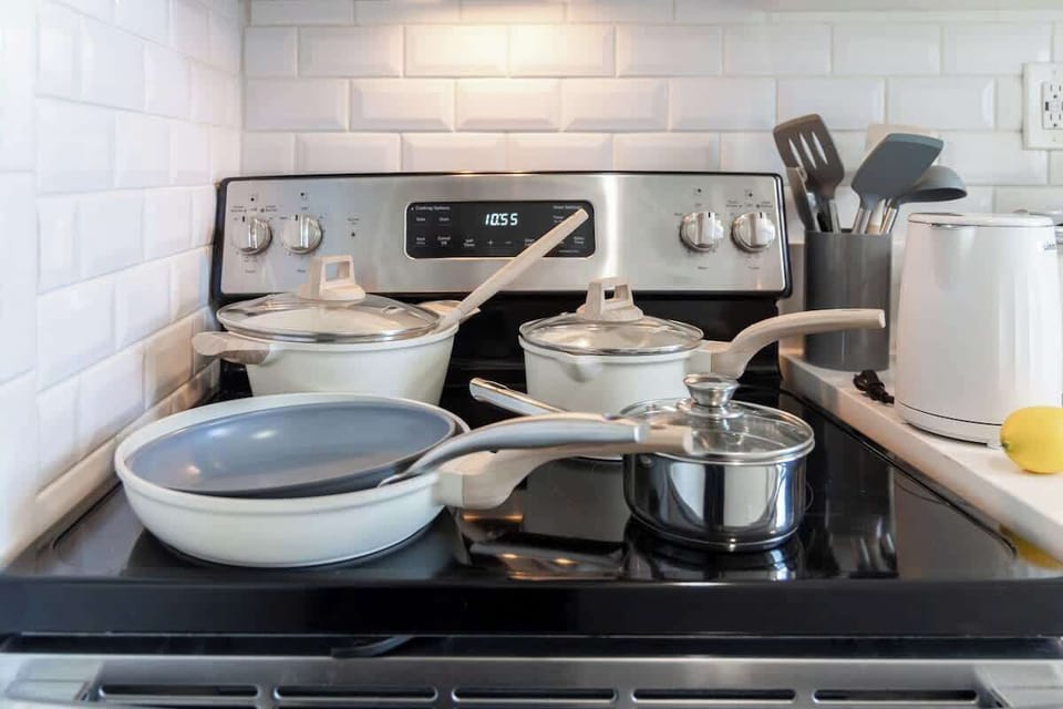 Whip up your favorite meals in our fully equipped kitchen, featuring a modern stovetop and a complete set of cookware for all your culinary adventures.
