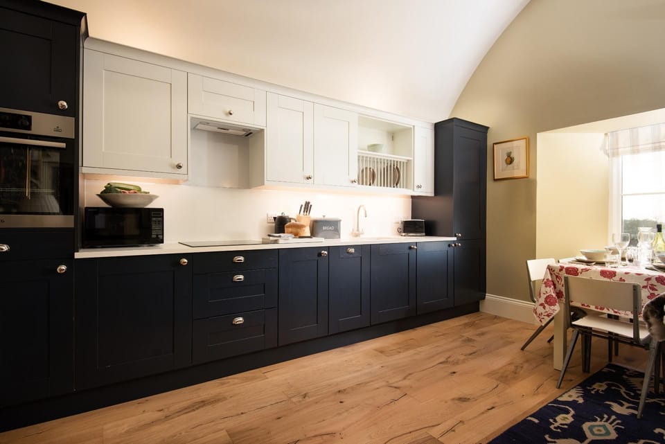 Lakeside Cottage - Alice - the single-wall kitchen is neat and compact, with all of the essentials for a self-catered stay