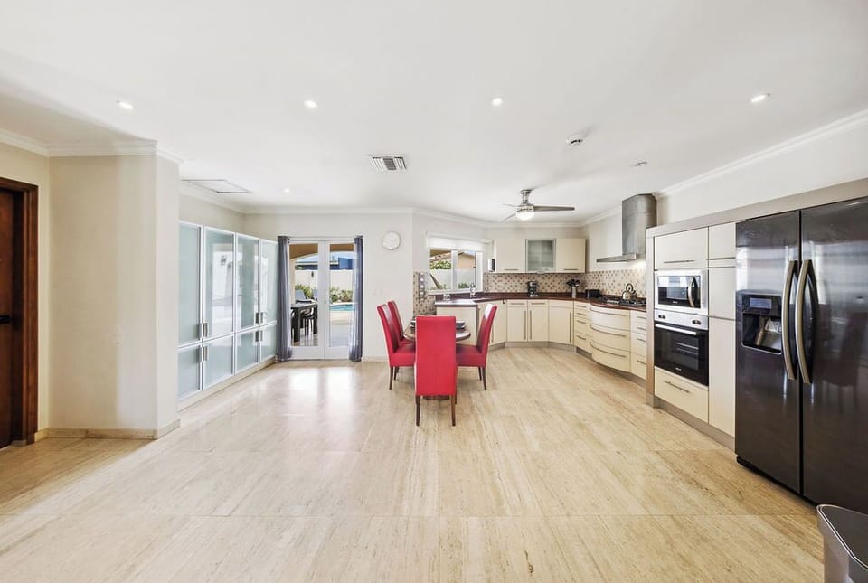 Your spacious open-concept kitchen awaits, fully equipped with modern appliances, ample counter space, and a cozy dining area—perfect for preparing and enjoying memorable meals together.