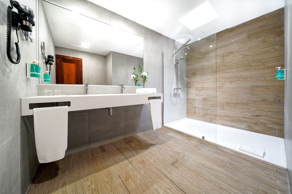 Shower, hair dryer, slippers, towels