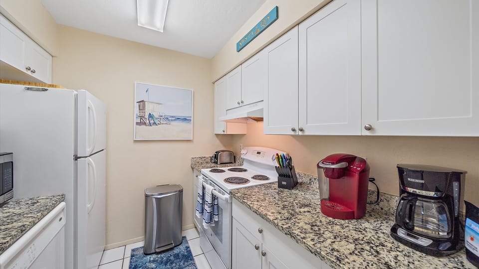 Fully stocked kitchen with Keurig and Drip coffee makers.