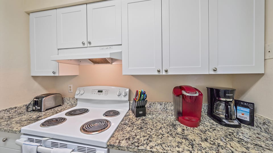 Fully stocked kitchen with Keurig and Drip coffee makers.