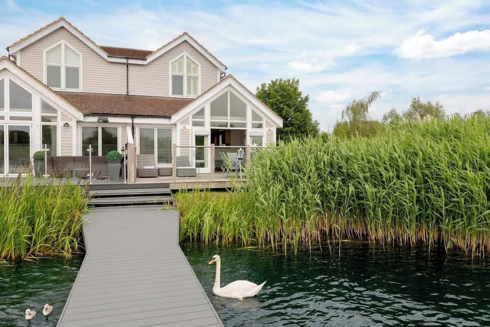 Mornings start here - with swans, still water, and nowhere else to be.