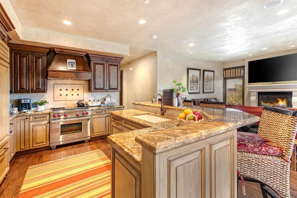 Your chef’s kitchen includes granite counters, premium appliances, and a central island for easy prep and serving.







 VIN-14