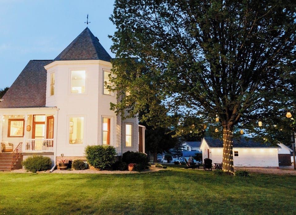 Outside view looking at front of house and side yard.
