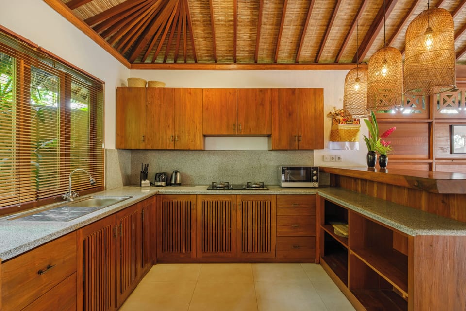 Villa, Balcony, Pool View | Private kitchen | Electric kettle, dining tables