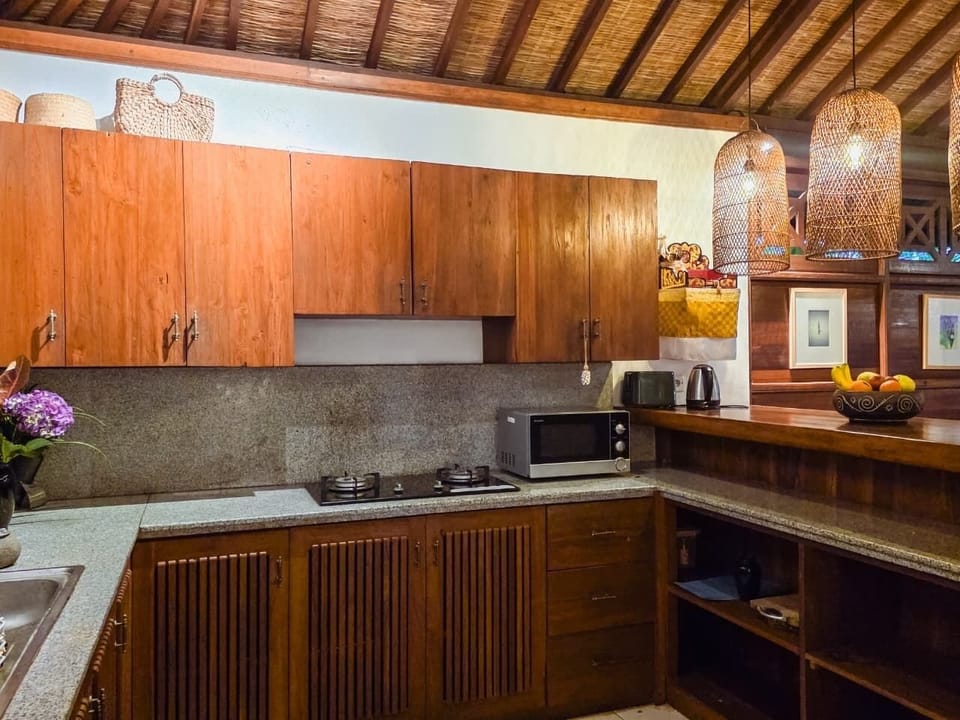 Villa, Balcony, Pool View | Private kitchen | Electric kettle, dining tables