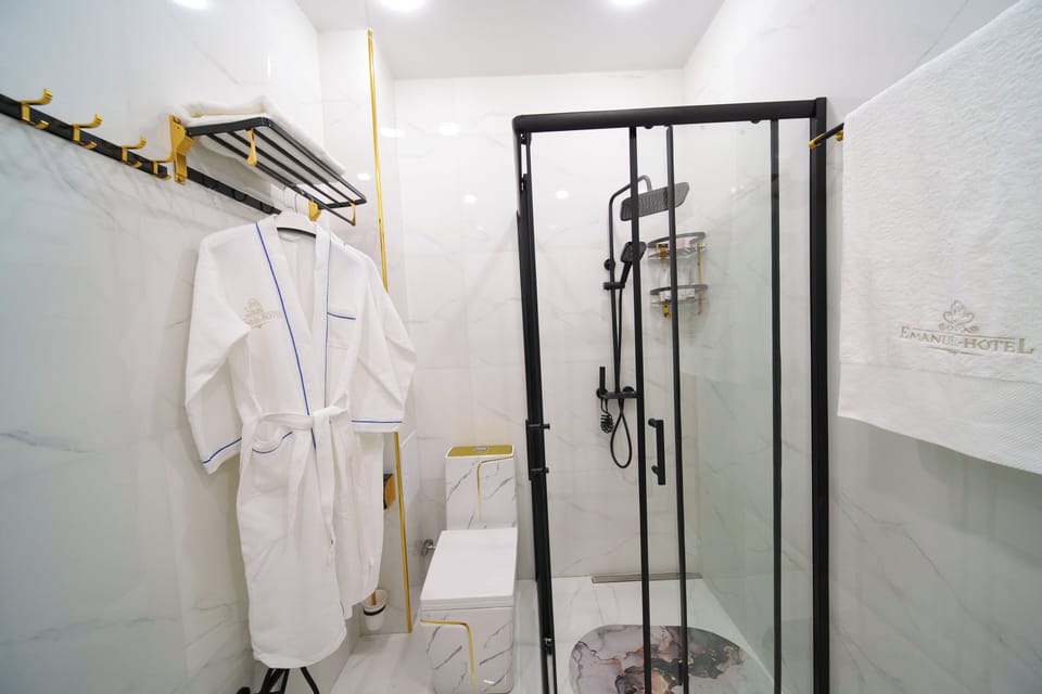 Shower, hair dryer, slippers, towels