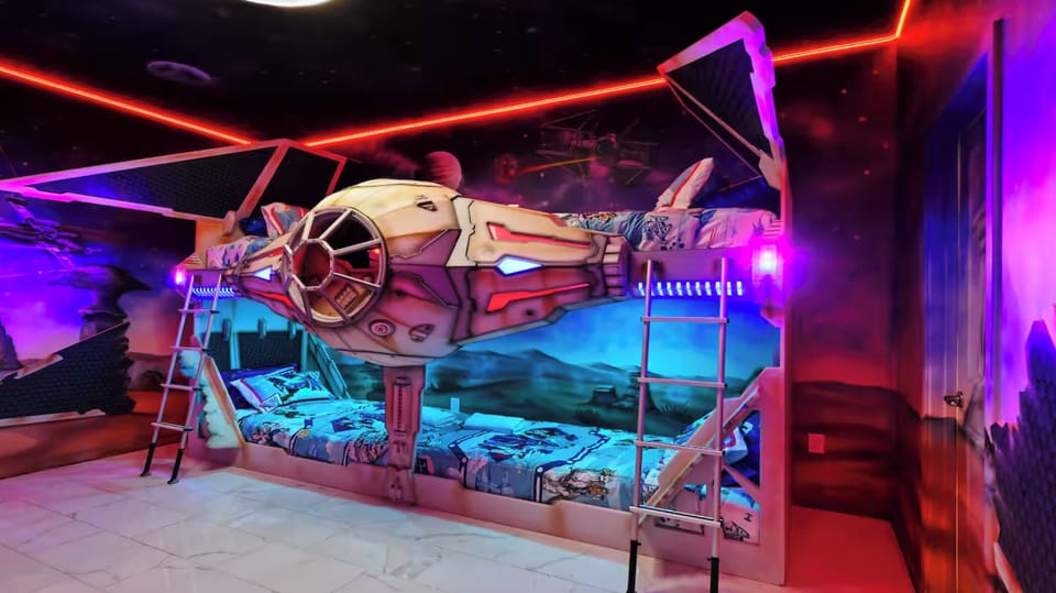 Epic space-themed fun with glowing walls and cozy twin bunks!