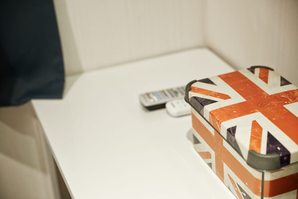 Desk, laptop workspace, blackout drapes, iron/ironing board