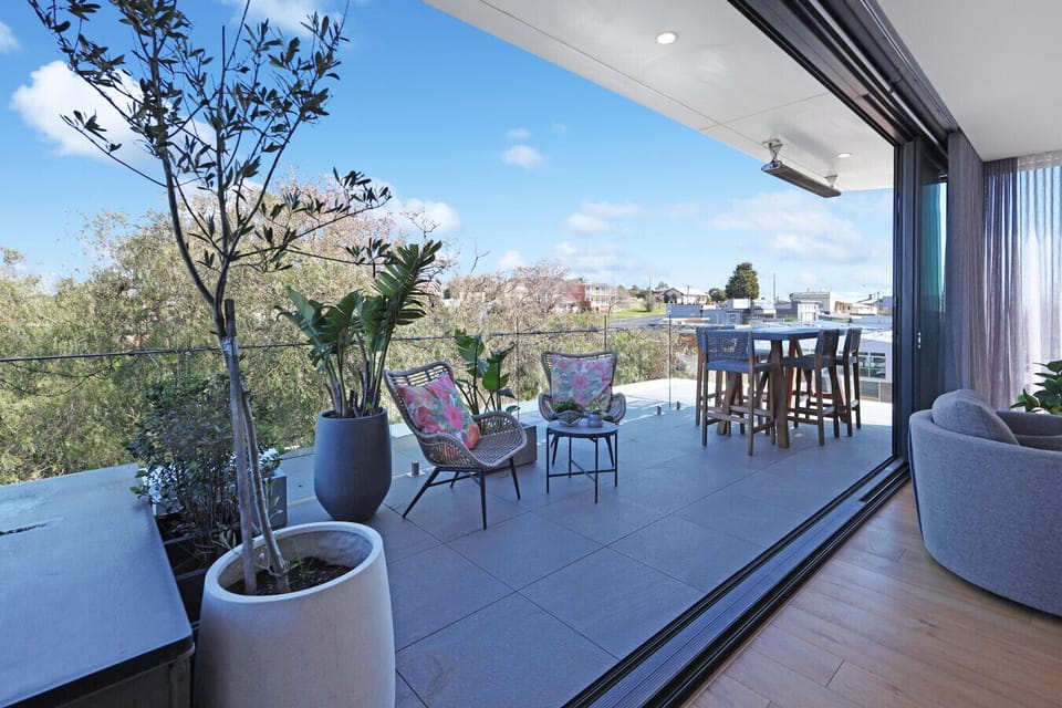 Spacious balcony with outdoor seating and open views—perfect for morning coffee or sunset drinks.