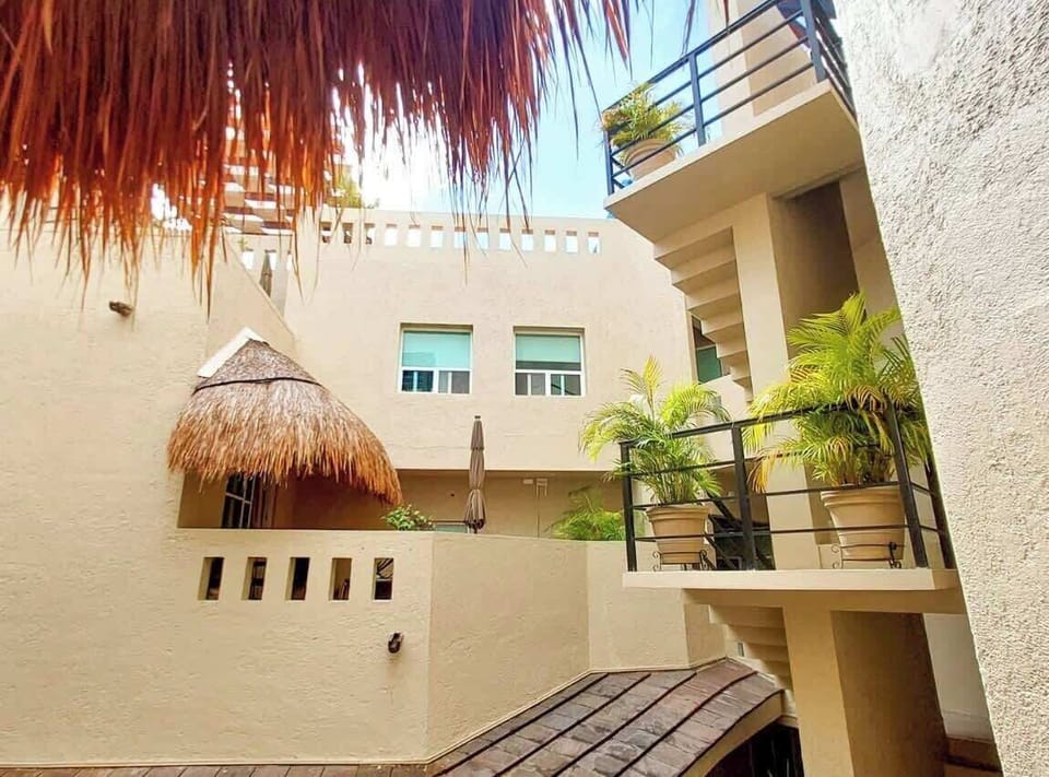 Shared rooftop palapa lounge