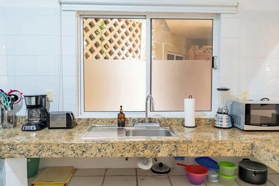 Full bathroom with hot water, body wash and shampoo