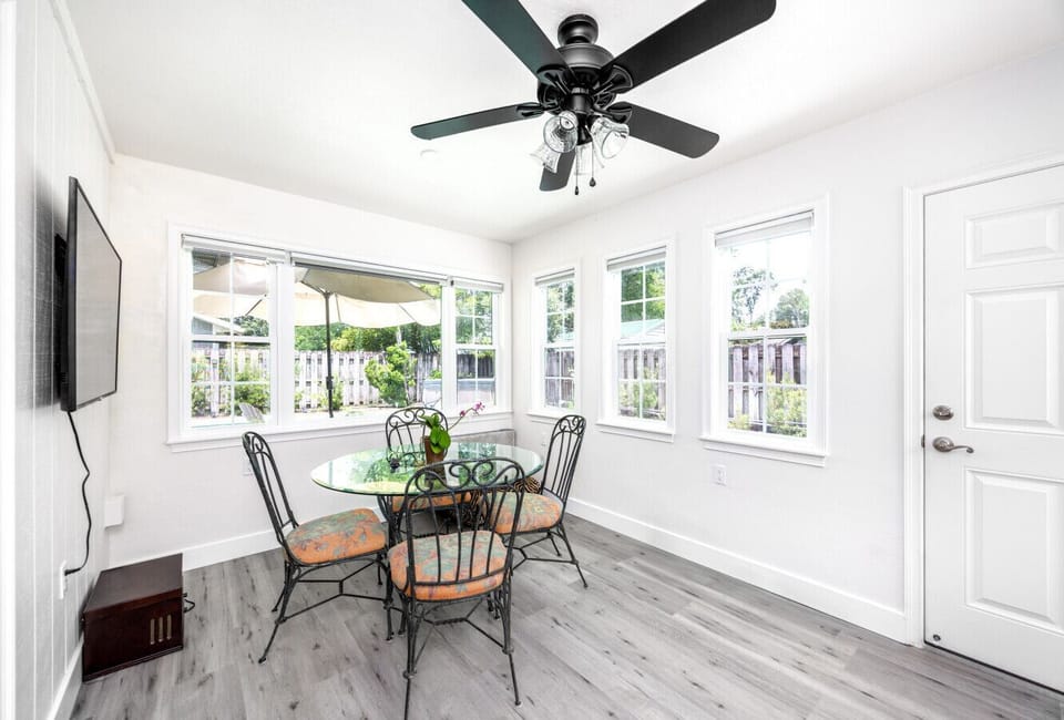 Bright and Cheerful Florida Room with Seating for 4 and TV