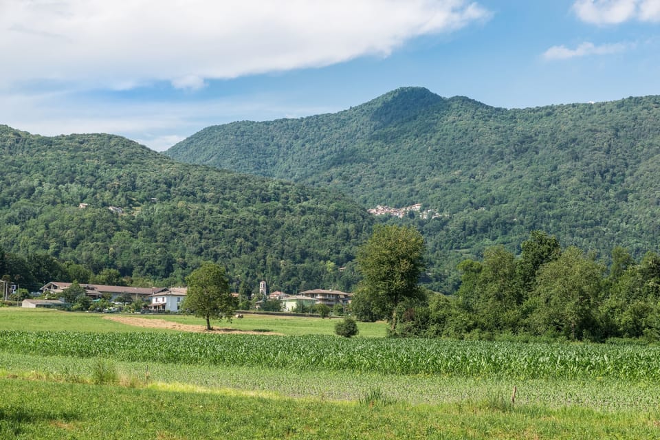 Valcuvia with Casalzuigno and above, in the background, the village of Arcumeggia
