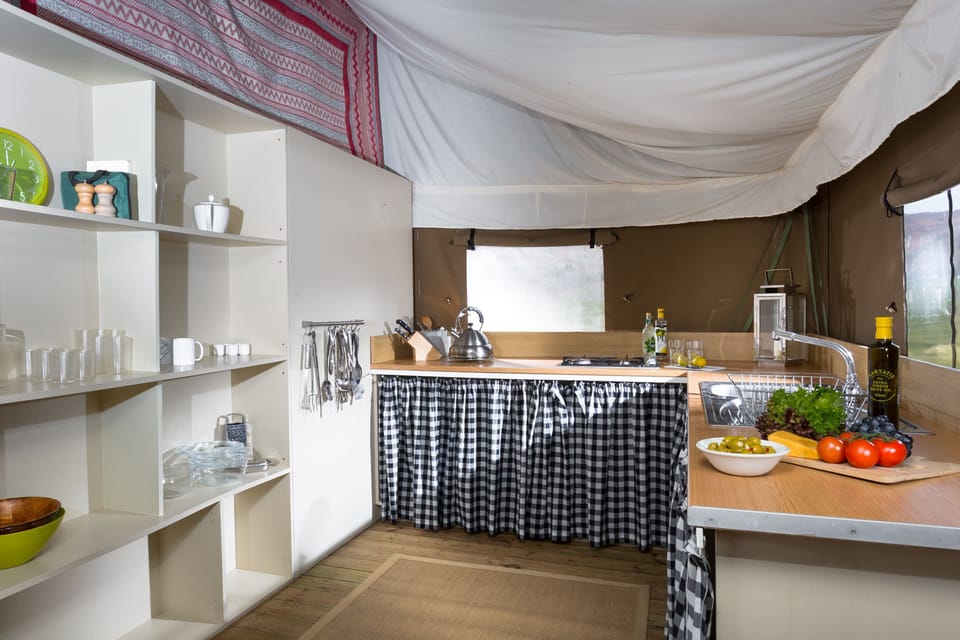 Well equipped kitchen with a double gas hob and utensils