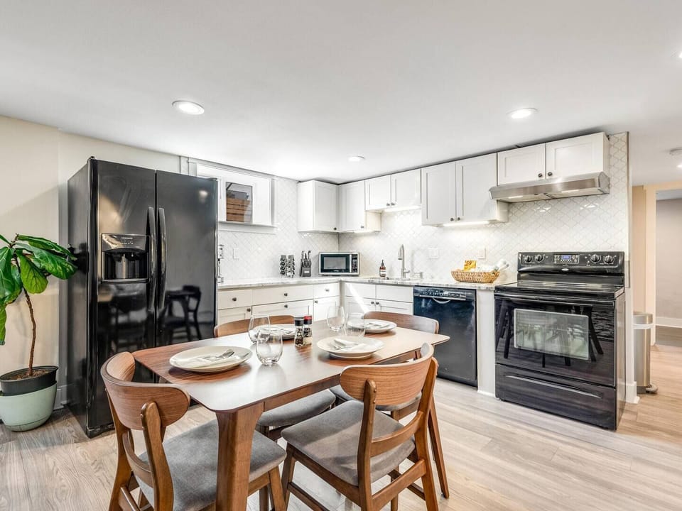 Modern kitchen with full appliances + dining for 6 — cook meals at home or enjoy takeout from Denver’s foodie hotspots