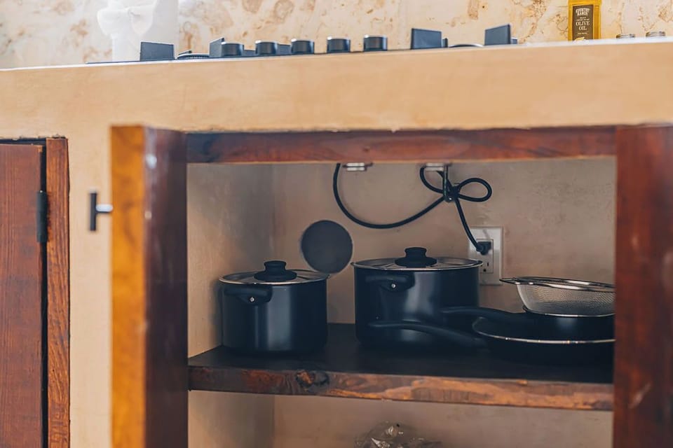 Fully stocked cabinet with quality pots and pans for any meal you feel like preparing.

