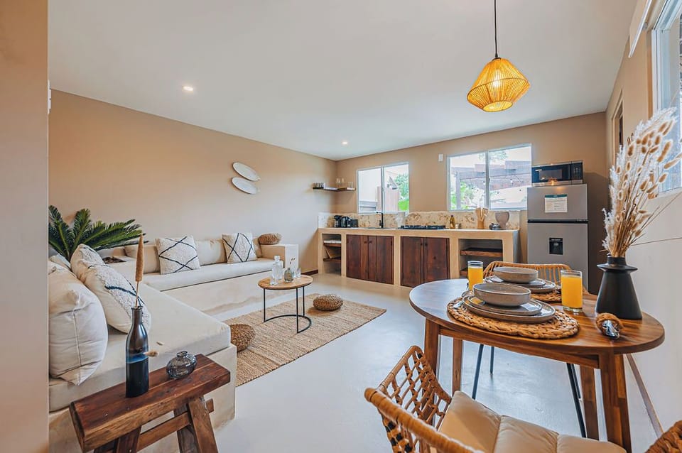 Start your day with breakfast and sunlight in this open-plan kitchen and lounge area.


