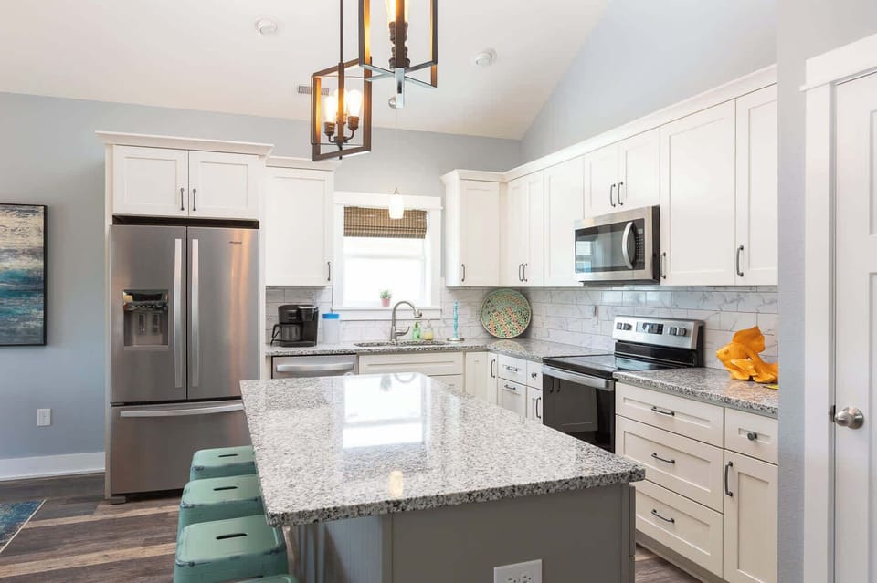 Top Floor Kitchen W/ Granite Countertops, Stainless Steel Appliances, a Beadboard-Accented Island, and Soft-Close Cabinetry