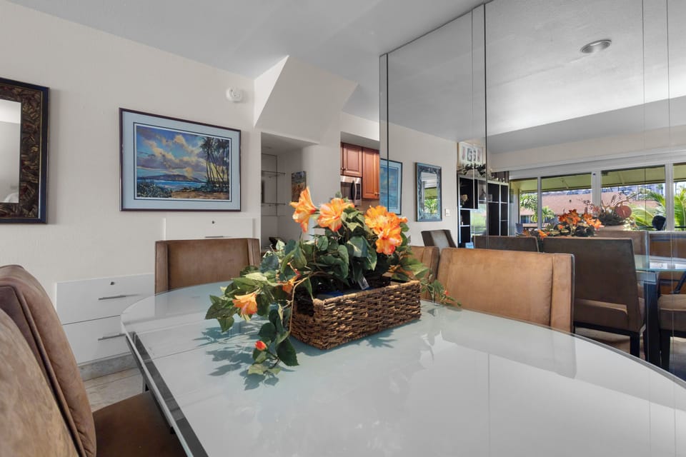 Gather around this spacious dining table where your group can share meals together in bright, airy comfort beneath vaulted ceilings and natural light.
