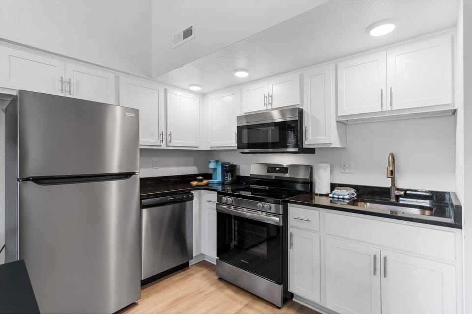 The open kitchen is fully equipped for an unforgettable getaway