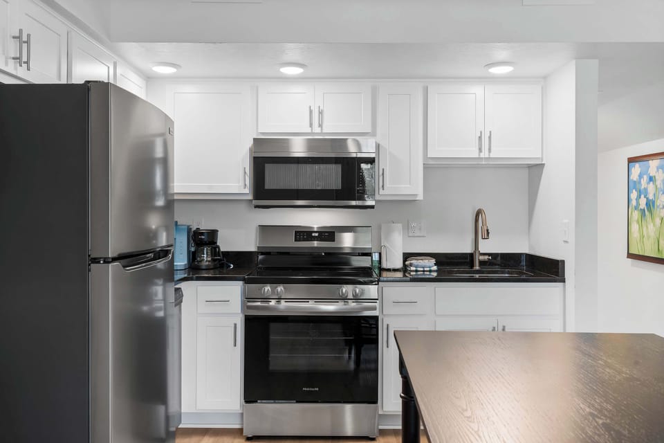 The open kitchen is fully equipped for an unforgettable getaway