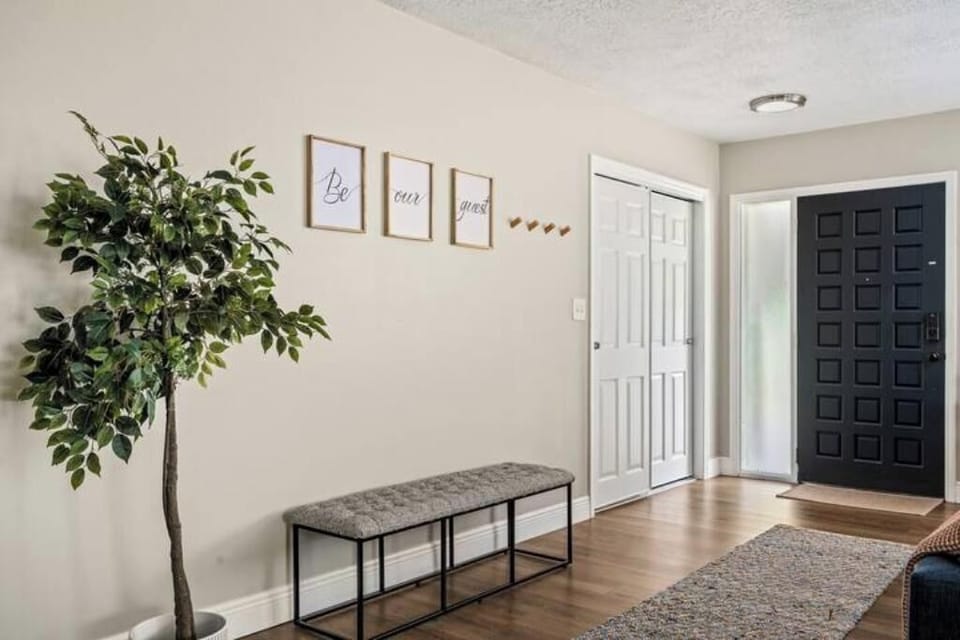 Welcoming entrance with a cozy bench—perfect for bags or slipping off shoes.
