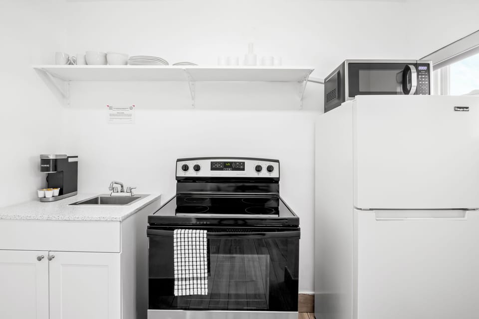 Family Studio Suite, 2 Queen Beds, Kitchen, Canal View | Private kitchen | Coffee/tea maker, mini-fridge, microwave