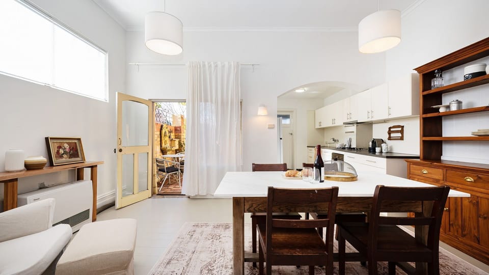 Enter into the cutest kitchen dining area around 