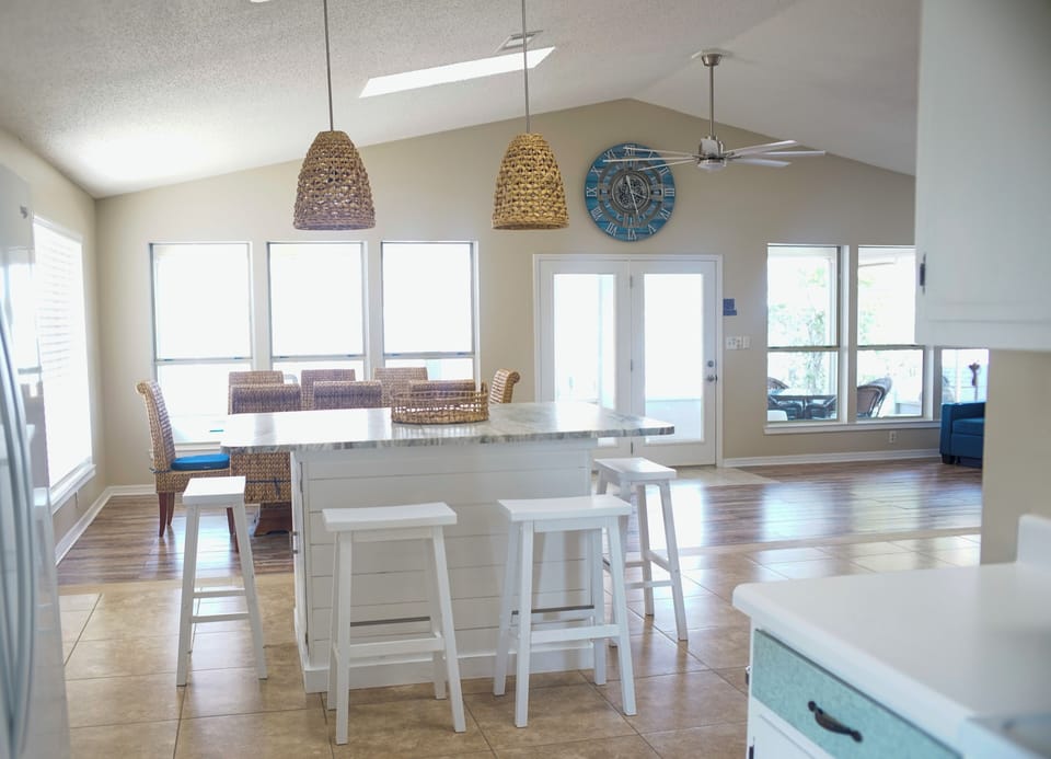 View from kitchen with plenty of window and water view.