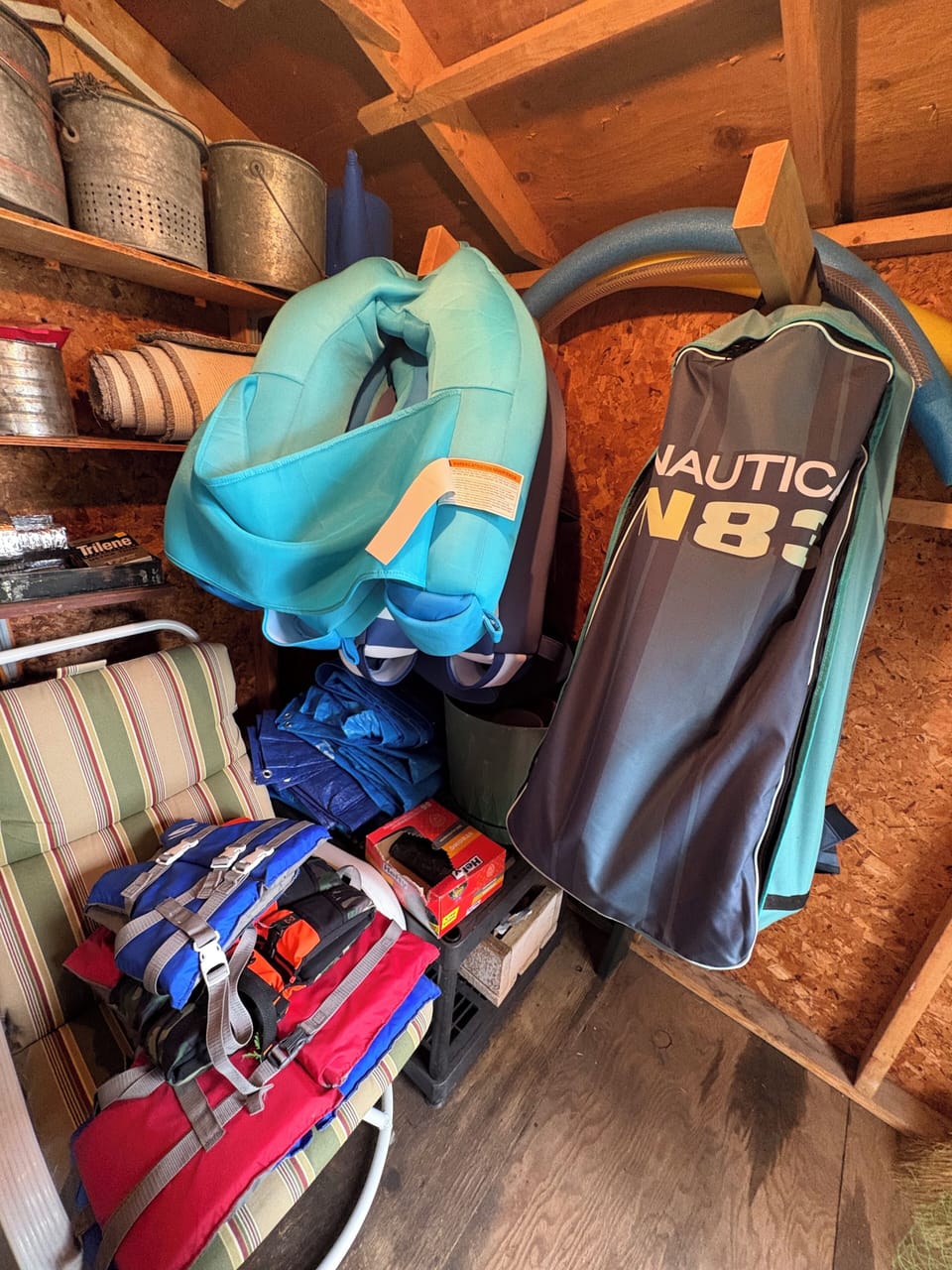 Waterside shed contains life jackets, fishing poles and inflatable paddle boards