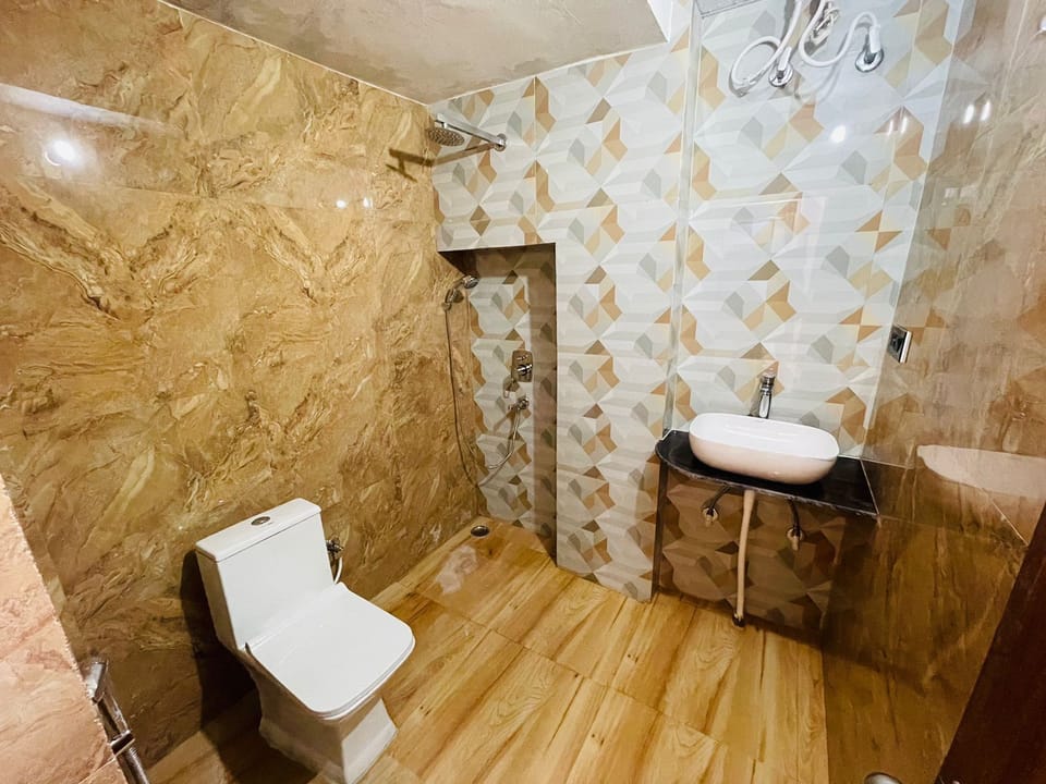 Separate tub and shower, slippers, towels, soap
